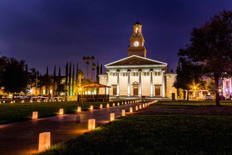 the university of Redlands lit up at night after an event